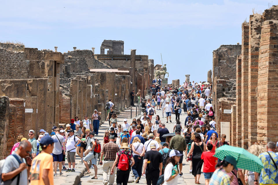 Crowd of tourists on the main street of the Pompeii (Marco Cantile / LightRocket via Getty Images)