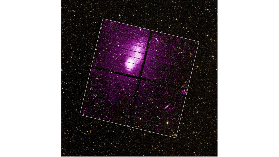 A purple-hued galaxy cluster is seen in space. A white box indicates the main area.