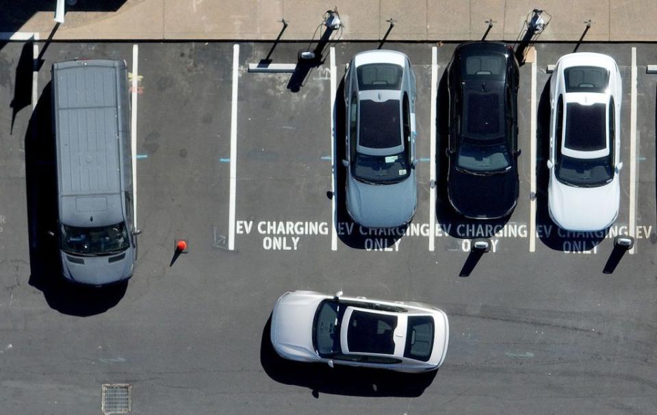 evs charging in a parking lot