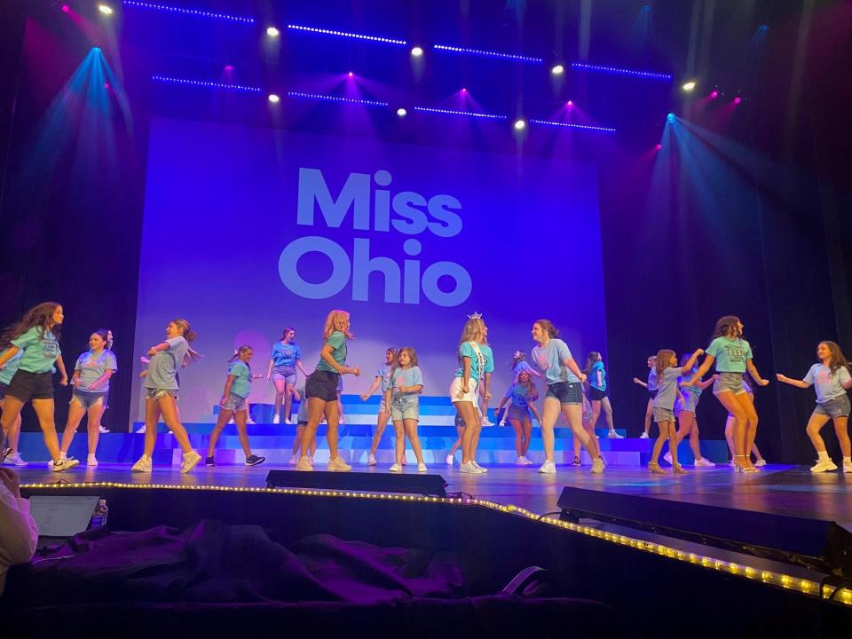 Miss Ohio's Teen contestants, Little Miss Buckeyes and the new 2024 Miss Ohio's Teen Allie Gray, 17. of Celina, center with crown, danced together Thursday on the Miss Ohio stage at the Renaissance Theatre.