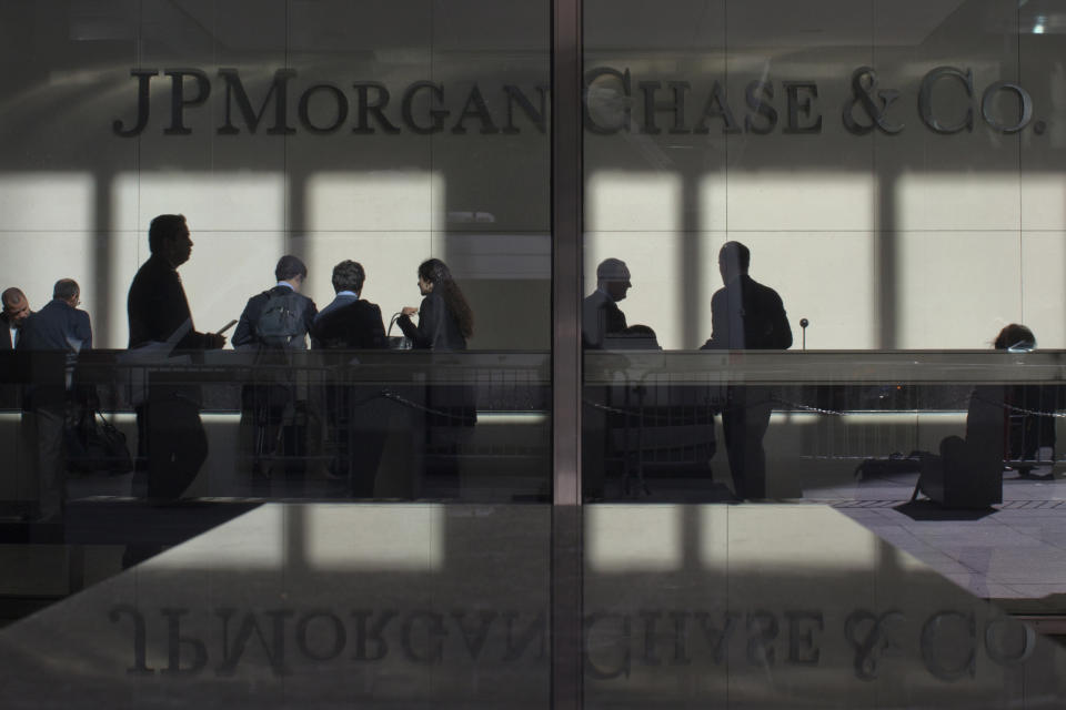 The lobby of JPMorgan headquarters is photographed through its front doors in New York May 11, 2012.  Stocks fell at the open on Friday after JPMorgan Chase & Co revealed a trading loss of at least $2 billion from a failed hedging strategy, dragging bank shares lower.   REUTERS/Eduardo Munoz (UNITED STATES - Tags: BUSINESS TPX IMAGES OF THE DAY)