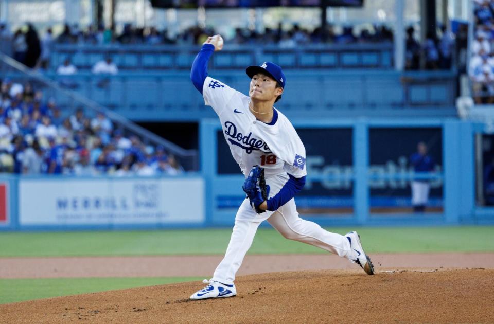 Dodgers starting pitcher Yoshinobu Yamamoto throws against the Royals on Saturday.