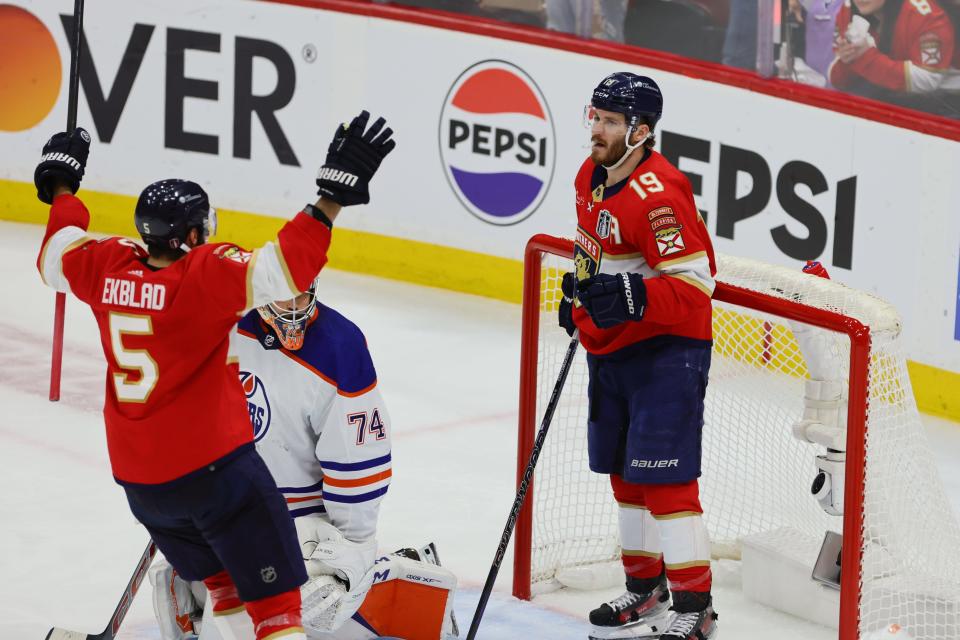 Jun 18, 2024; Sunrise, Florida, USA; Florida Panthers forward Matthew Tkachuk (19) celebrates scoring against Edmonton Oilers goaltender Skinner Stuart (74) with defenseman Aaron Ekblad (5) during the second period in game five of the 2024 Stanley Cup Final at Amerant Bank Arena. Mandatory Credit: Sam Navarro-USA TODAY Sports