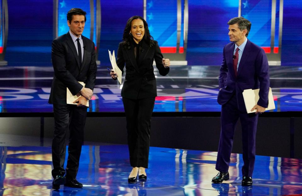 Moderators (L to R) David Muir and Linsey Davis of ABC News at Saint Anselm College in Manchester, New Hampshire on February 7, 2020.