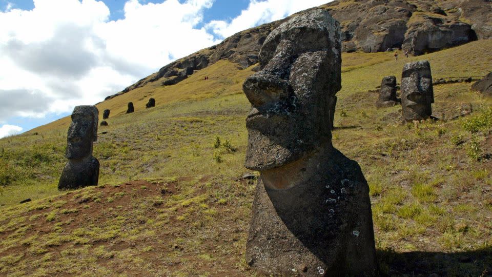 Huge stone statues, known as moai in the indigenous Rapa Nui language, stand out on a hillside of the Rano Raraku volcano on Easter Island in the Pacific Ocean off the coast of Chile in 2005. - Martin Bernetti/AFP/Getty Images