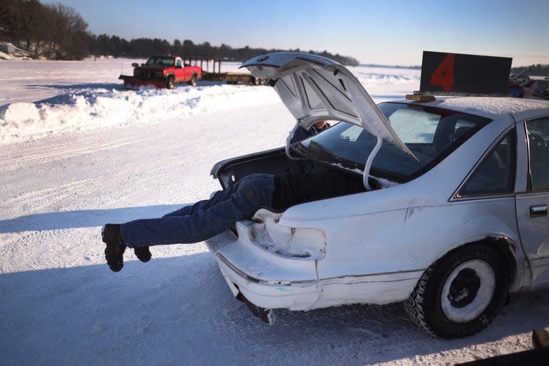 RICE LAKE, WISCONSIN - FEBRUARY 20: Mark Barta makes a repair to his race car following a race on February 20, 2021 in Rice Lake, Wisconsin. The races were hosted by Rice Lake Ice Racing on an oval track laid out on the ice over Rice Lake in northern Wisconsin. - Photo: Scott Olson (Getty Images)