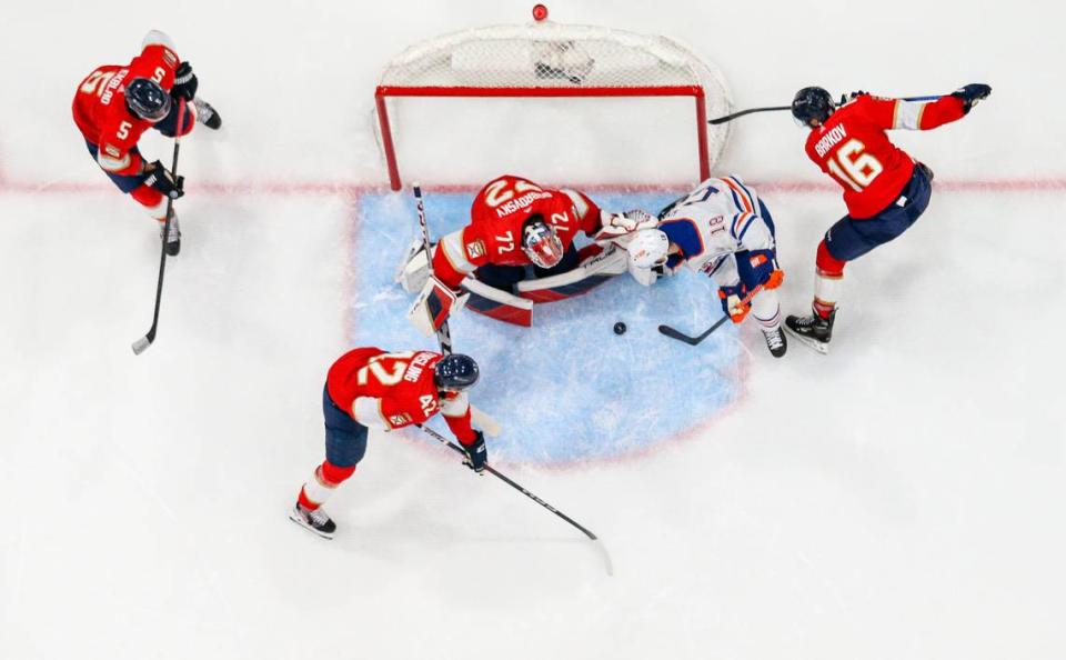 Florida Panthers goaltender Sergei Bobrovsky (72) works with center Aleksander Barkov (16) and defenseman Gustav Forsling (42) to block a shot by Edmonton Oilers left wing Zach Hyman (18) in the second period of Game 1 of the NHL Stanley Cup Finals at the Amerant Bank Arena on Saturday, June 8, 2024, in Sunrise, Fla.