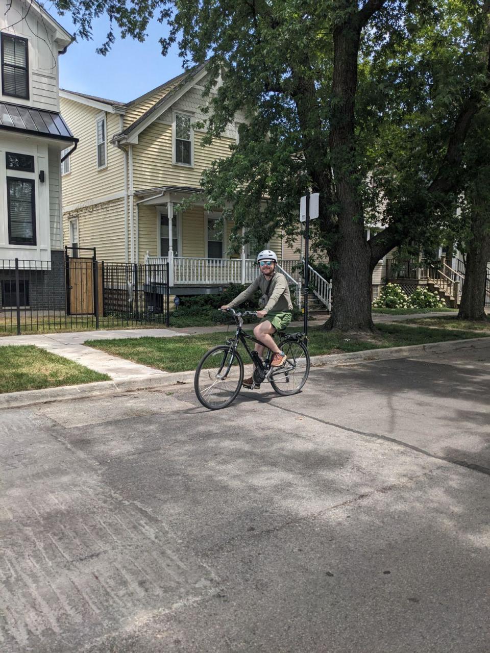 John Nicholas, 28, riding his bicycle.