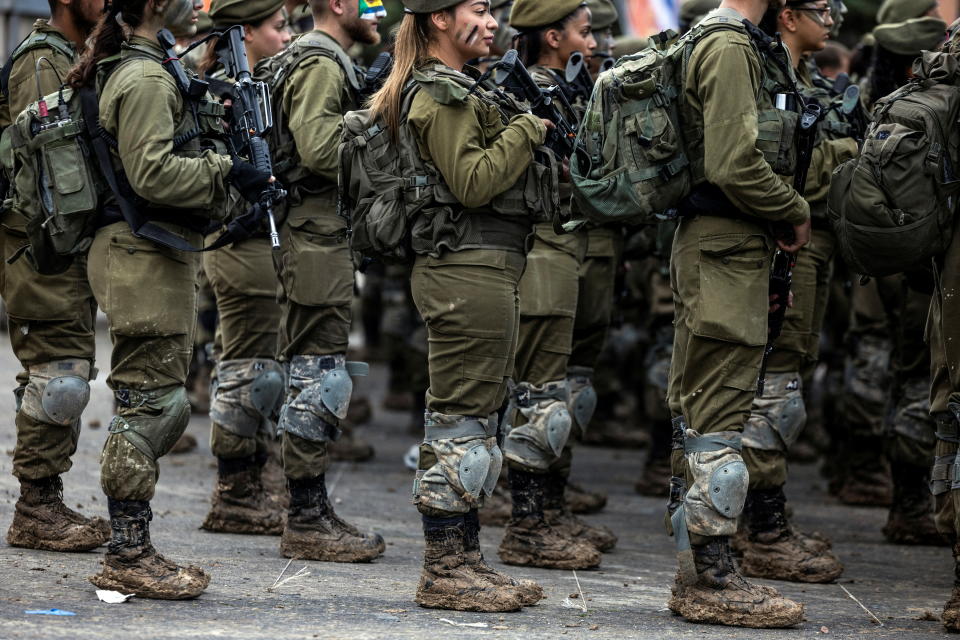 Members of Israel's coed Search and Rescue Brigade participate in an intensive march after which they will receive their brigade berets, in Latrun, Israel on February 1, 2024, amid the ongoing conflict in Gaza between Israel and the Palestinian Islamist group Hamas. Israel is one of the few countries in the world where military service is compulsory for women from the age of 18, and female soldiers serving in combat units or in support roles away from the front line have featured prominently at different stages of the current war in Gaza. Women serve as military pilots, in naval units and in the infantry, training with male counterparts and serving under the same conditions. REUTERS/Ronen Zvulun