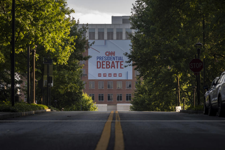 Banners are placed outside of CNN studios ahead of the first presidential debate in Atlanta, Georgia on June 24, 2024. Two years after the US Supreme Court stripped constitutional protections for abortion, the explosive issue will feature prominently in Thursday's debate between Joe Biden and Donald Trump -- with the Republican under pressure not to alienate voters. (Photo by CHRISTIAN MONTERROSA / AFP) (Photo by CHRISTIAN MONTERROSA/AFP via Getty Images)