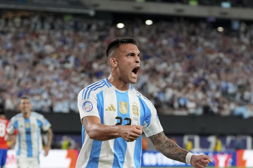 Argentina's Lautaro Martinez celebrates scoring his side's opening goal against Chile during a Copa America Group A soccer match in East Rutherford, N.J., Tuesday, June 25, 2024.