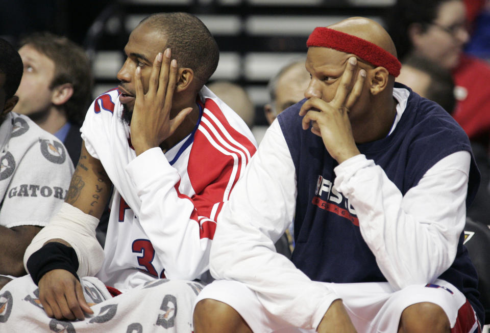 Detroit Pistons' Richard Hamilton, left, and Charlie Villanueva watch from the bench late in the fourth quarter of the Indiana Pacers 105-93 win an NBA basketball game Friday, Jan. 22, 2010, in Auburn Hills, Mich. (AP Photo/Duane Burleson)