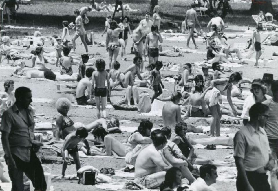 Cue the theme from “Jaws.” The beach is crowded at Portage Lakes State Park on July 5, 1976.