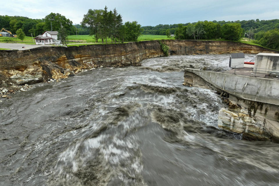 Floodwater continues to carve a channel around the Rapidan Dam,  near Mankato, Minn. (Mark Vancleave / AP)