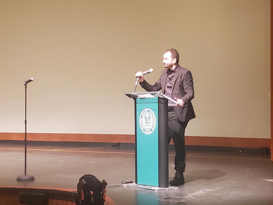 Nicholas Hurwitz-Goodman speaks at a June 29, 2024 memorial event for his father, human rights lawyer Bill Goodman, at Wayne State University's Community Arts Auditorium.