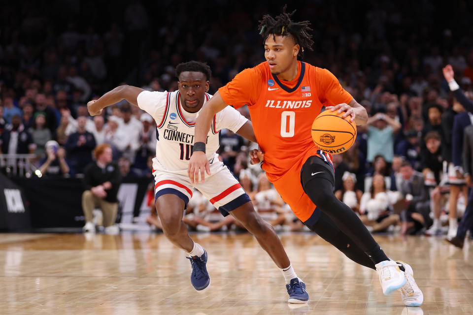 BOSTON, MASSACHUSETTS - MARCH 30: Terrence Shannon Jr. #0 of the Illinois Fighting Illini drives to the basket against Hassan Diarra #10 of the Connecticut Huskies during the second half in the Elite 8 round of the NCAA Men's Basketball Tournament at TD Garden on March 30, 2024 in Boston, Massachusetts. (Photo by Michael Reaves/Getty Images)