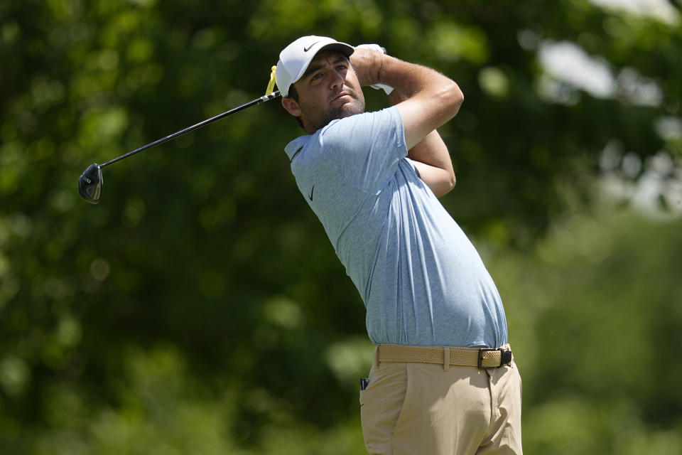 Scottie Scheffler hits from the fifth tee during the final round of the Memorial golf tournament, Sunday, June 9, 2024, in Dublin, Ohio. (AP Photo/Sue Ogrocki)