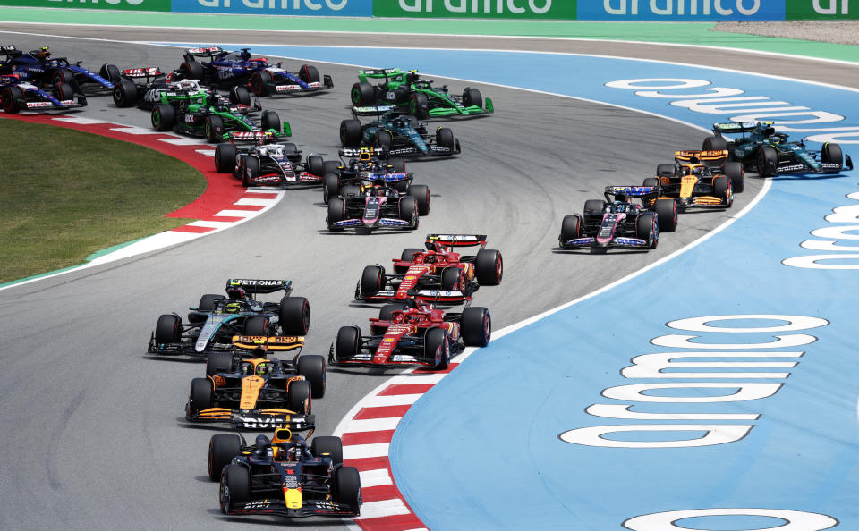 Red Bull driver Max Verstappen of the Netherlands leads the group during the firsts laps of the Formula 1 Spanish Grand Prix at the Barcelona Catalunya racetrack in Montmelo, near Barcelona, Spain, Sunday, June 23, 2024. (AP Photo/Joan Monfort)