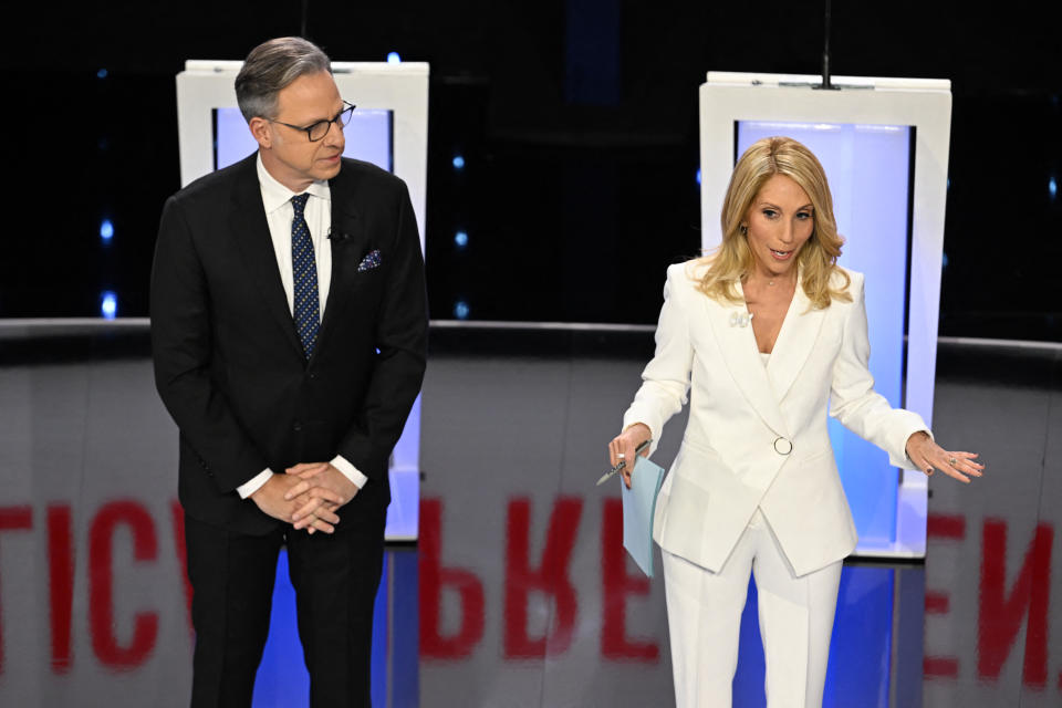 Moderators and CNN anchors Jake Tapper (L) and Dana Bash speak ahead of the fifth Republican presidential primary debate between Florida Governor Ron DeSantis and former US Ambassador to the UN Nikki Haley at Drake University in Des Moines, Iowa, on January 10, 2024. (Photo by Jim WATSON / AFP) (Photo by JIM WATSON/AFP via Getty Images)