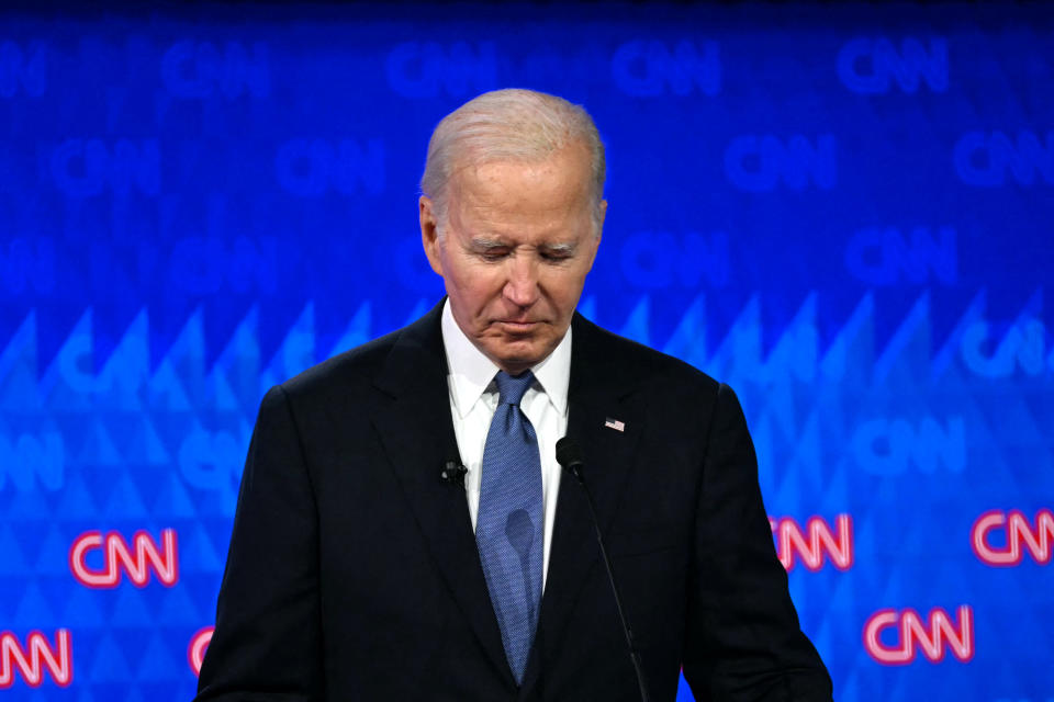 TOPSHOT - US President Joe Biden looks down as he participates in the first presidential debate of the 2024 elections with former US President and Republican presidential candidate Donald Trump at CNN's studios in Atlanta, Georgia, on June 27, 2024. (Photo by ANDREW CABALLERO-REYNOLDS / AFP) (Photo by ANDREW CABALLERO-REYNOLDS/AFP via Getty Images)