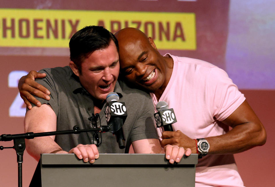 HOLLYWOOD, CALIFORNIA - SEPTEMBER 12: Chael Sonnen receives a hug from Anderson Silva during a Jake Paul v Anderson Silva press conference at NeueHouse Hollywood on September 12, 2022 in Hollywood, California. (Photo by Harry How/Getty Images)