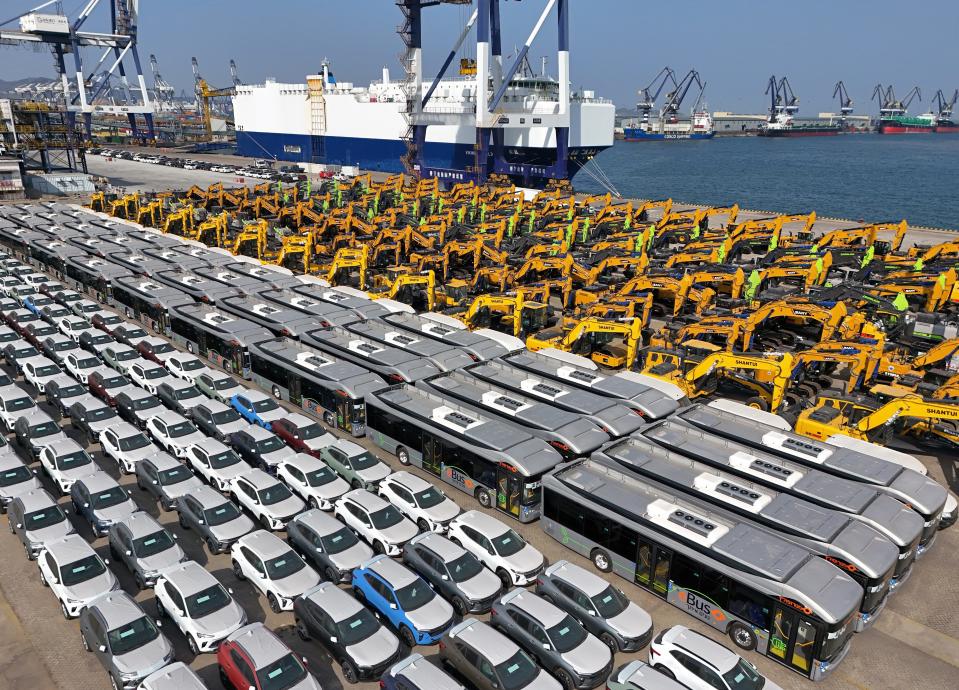 A large number of Chinese-made cars and construction machinery are gathering at the port of Yantai, waiting to be loaded for export, in Yantai, China, on April 1, 2024.