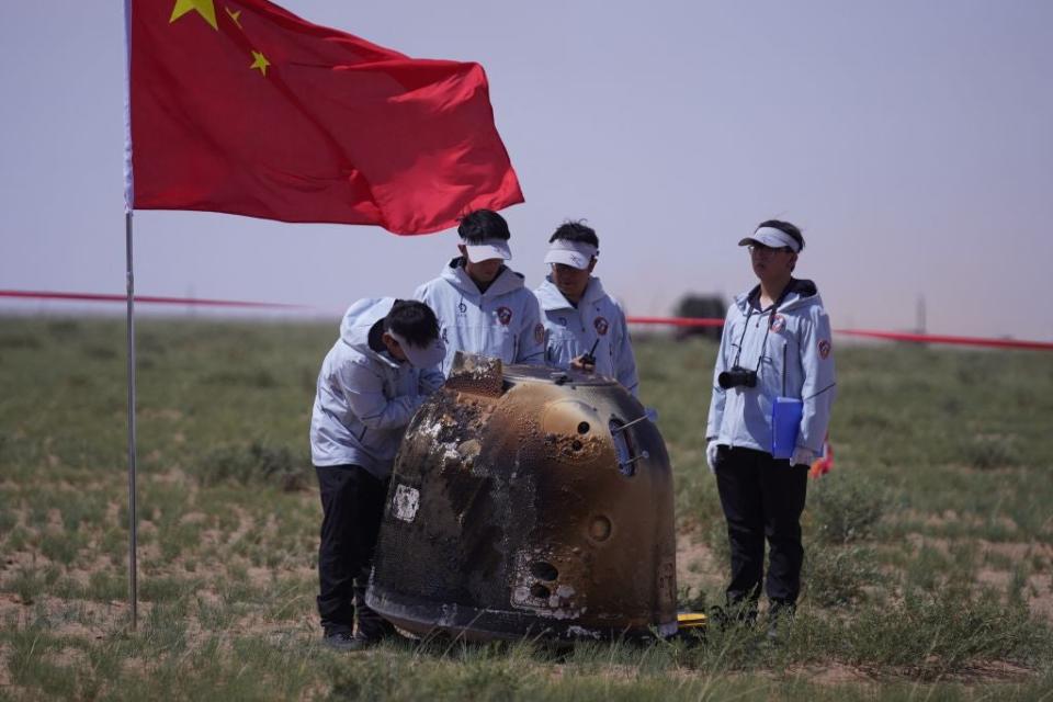 Officials prepare to recover the landing module of the Chang'e-6 moon probe after it landed in Inner Mongolia, in northern China on June 25, 2024.