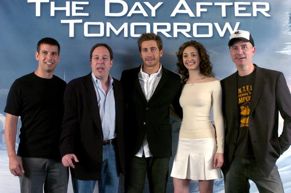 (dpa) - (From L:) Script writer Jeffrey Nachmanoff, producer Mark Gordon, actor Jake Gyllenhaal, actress Emmy Rossum and the German director Roland Emmerich pose during a photo session for the promotion of their movie 'The Day After Tomorrow' in Berlin, Germany, on Wednesday 5 May 2004. The film's plot centres around a change in the world's climate and a resulting ice age. The movi