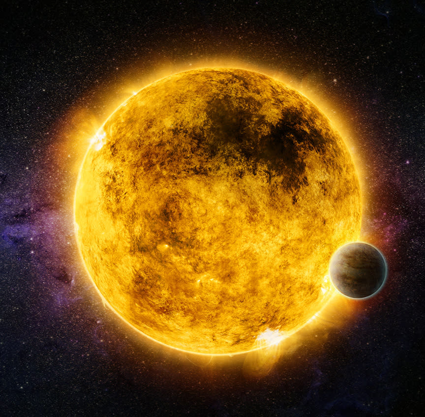 a giant blazing star hangs in the black of space, burning vibrant yellow and dark orange. A small planet sits to the right, just below the star's equator.