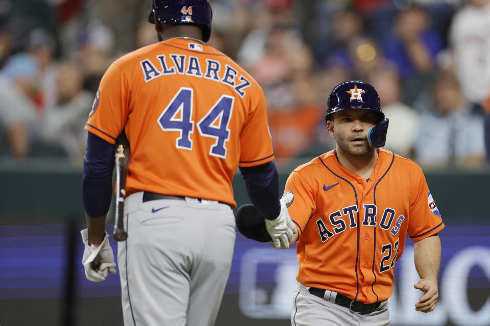 Yordan Álvarez #44 and José Altuve #27 of the Houston Astros 