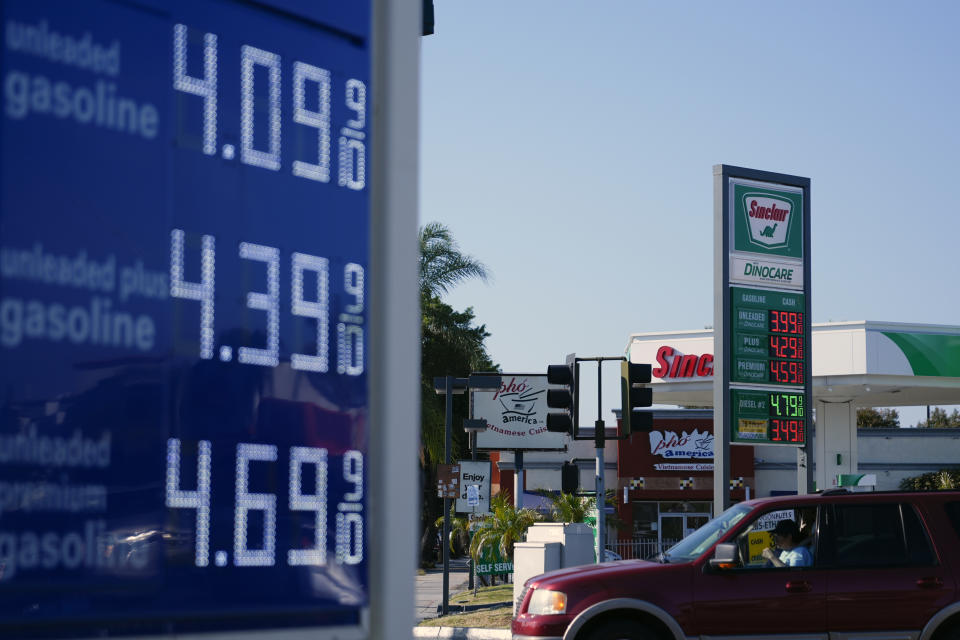 A sign at a Sinclair gas station is seen next to an Arco gas station advertising gasoline prices, Monday, June 10, 2024, in Long Beach, Calif. (AP Photo/Ryan Sun)