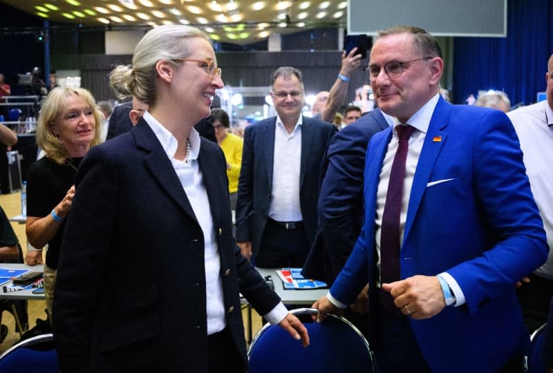 Tino Chrupalla, Federal Chairman of the Alternative for Germany (AfD), is pleased after his re-election as Spokesman of the Board at the AfD Federal Party Conference in the Grugahalle in Essen next to Alice Weidel, Federal Chairman of the AfD. At the two-day party conference, the AfD plans to elect a new federal executive committee, among other things. Numerous organizations have announced opposition to the meeting and more than a dozen counter-demonstrations. Bernd von Jutrczenka/dpa