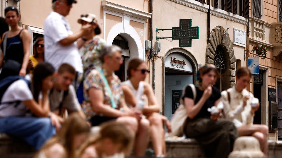 Tourists in southern Europe are being advised to acclimatize before embarking on any strenuous activities in the heat. - Guglielmo Mangiapane/Reuters