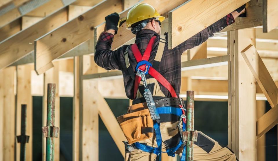 construction worker working on single-family home