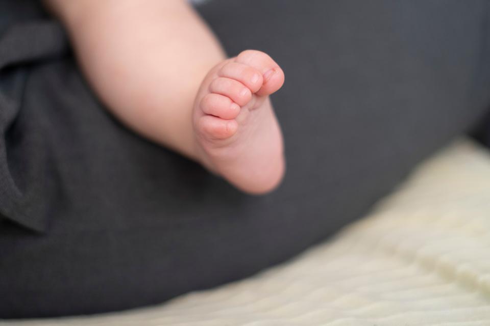 Close-up of the foot of a 6-month-old baby in Lyon, France on 25 May 2023.