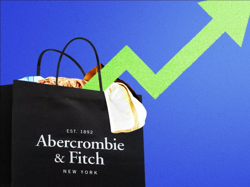 Upward trending arrow emerging from an Abercrombie & Fitch shopping bag filled with clothes