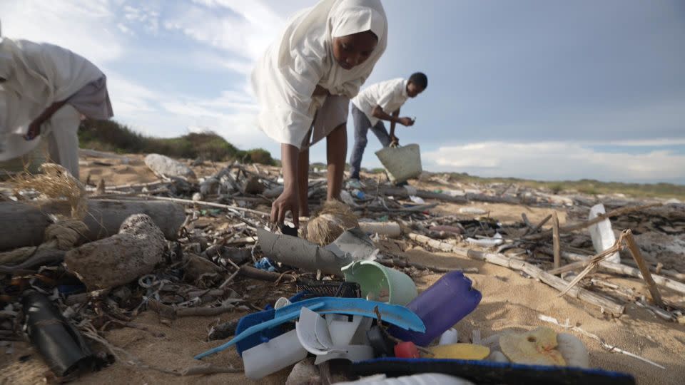 A beach cleanup in Lamu, Kenya, carried out as part of Call to Earth Day 2022 by a club that includes several schools, organized by the Lamu Marine Conservation Trust. - CNN