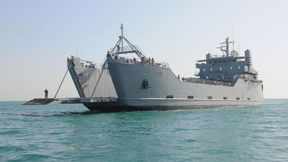 Army logistics support vessel USAV SP/4 James A. Loux prepares to conduct a stern gate transfer with amphibious dock landing ship Carter Hall. (Petty Officer 3rd Class Kristin L. Grover/Navy)