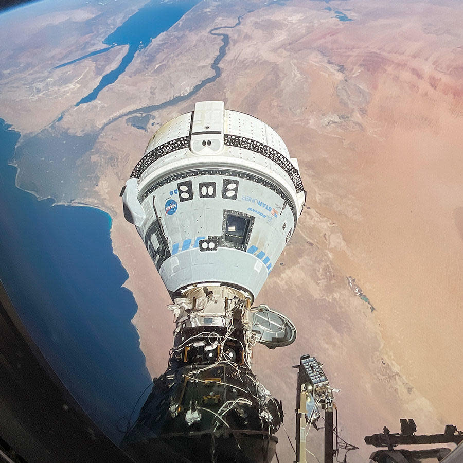 A spectacular view of Boeing's Starliner crew ferry ship docked to the International Space Station's forward port as the two spacecraft pass above North Africa against the backdrop of the Nile river, the Gulf of Suez and the Red Sea, 260 miles below. / Credit: NASA