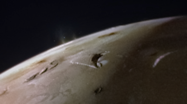  A view of the top of Io, a slight haze protrudes from the surface in one isolated location. 