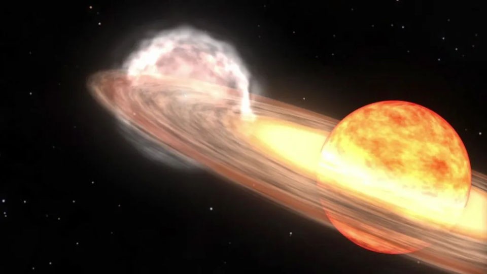 A red giant star and white dwarf orbit each other in this animation of a nova similar to T Coronae Borealis. The red giant is a large sphere in shades of red, orange, and white, with the side facing the white dwarf the lightest shades. The white dwarf is hidden in a bright glow of white and yellows, which represent an accretion disk around the star. A stream of material, shown as a diffuse cloud of red, flows from the red giant to the white dwarf.  / Credit: NASA/Goddard Space Flight Center