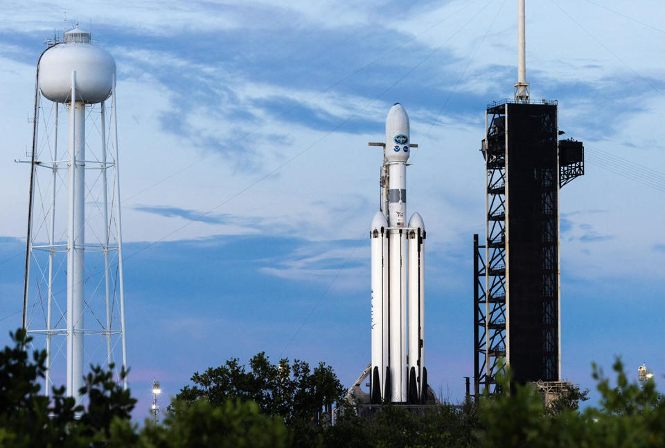 A SpaceX Falcon Heavy rocket carrying a National Oceanic and Atmospheric Administration GOES weather satellite sits atop historic pad 39A at the Kennedy Space Center awaiting blastoff Tuesday afternoon, weather permitting. / Credit: Adam Bernstein/Spaceflight Now