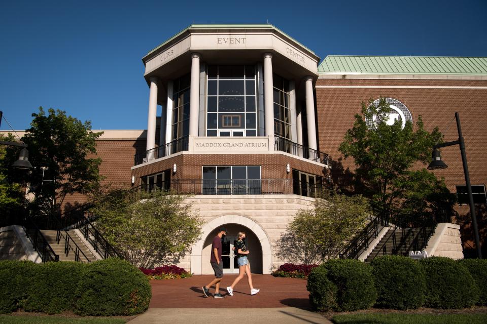 People walk past the Curb Event Center at Belmont University in Nashville.