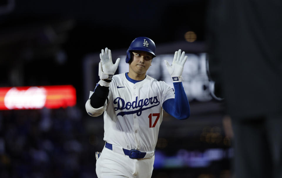 Los Angeles Dodgers' Shohei Ohtani celebrates after hitting a two-run home run against the Los Angeles Angels at Dodger Stadium on Friday in Los Angeles. (Photo by Kevork Djansezian/Getty Images)