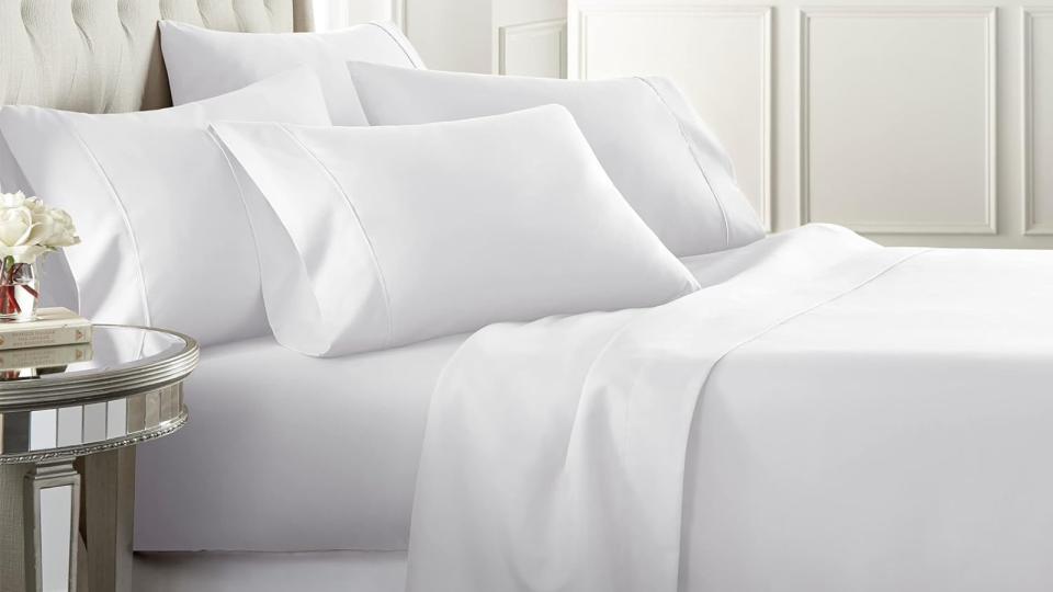 The white sheet set on a made bed