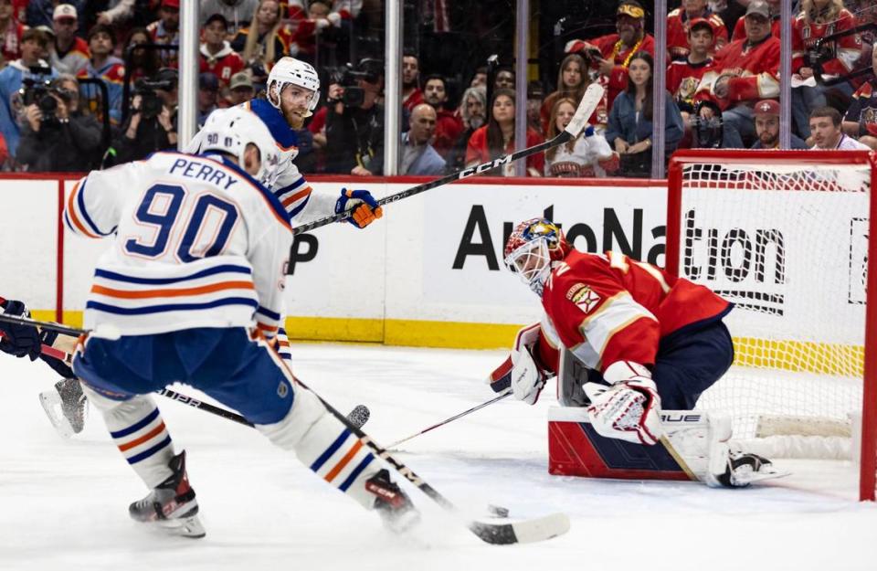 Sunrise, Florida, June 18, 2024 - Edmonton Oilers right wing Corey Perry (90) receives a pass from Edmonton Oilers center Connor McDavid (97) in front on the Panthers goal to score goal #4 for the Oilers