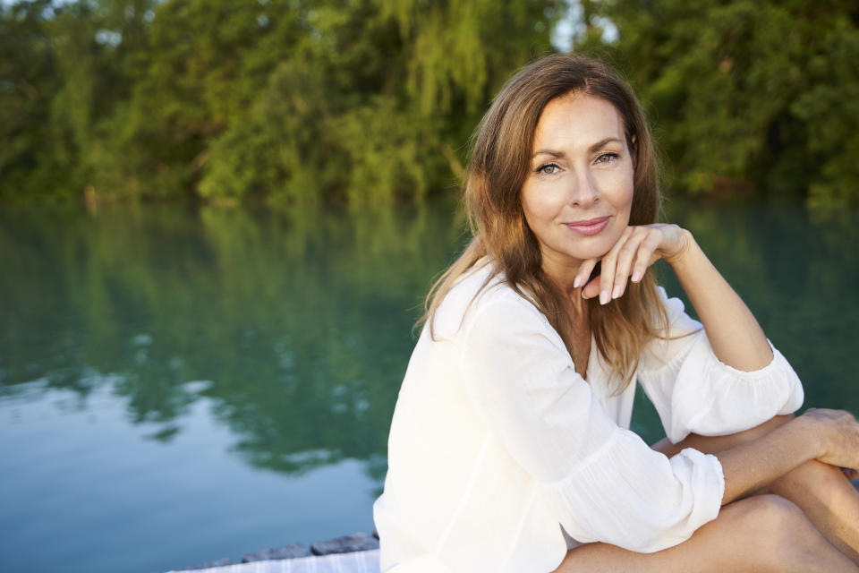 Image of woman over 50 on the water.