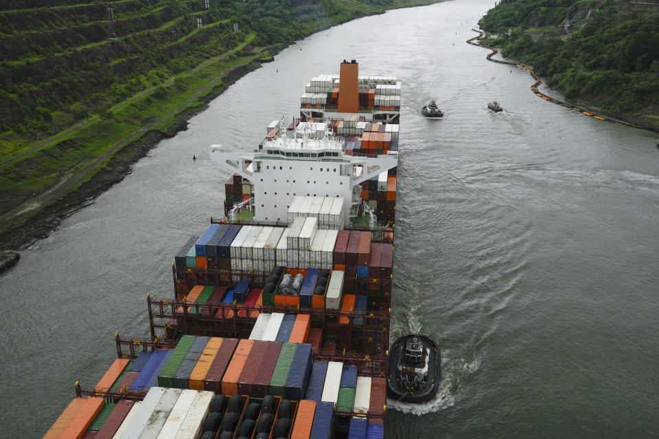 A cargo ship sails through the Panama Canal, in Panama City, Thursday, June 13, 2024. Panama Canal authorities reported they will increase vessel transits through the interoceanic waterway following drought-related restrictions. (AP Photo/Matias Delacroix)