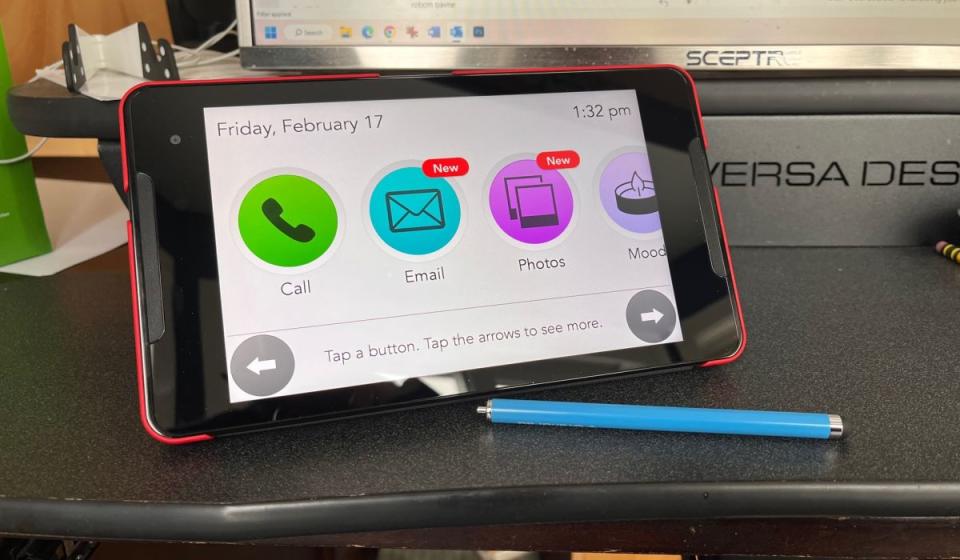 A photo showing the GrandPad tablet's home screen, with the stylus resting beside it.