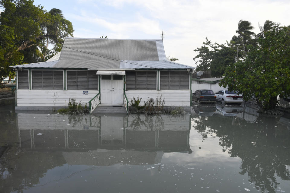 A flooded building surrounded by water in Christ Church, Barbados.